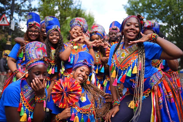 Participants taking part in the opening ceremony ahead of the family day at the Notting Hill Carnival in London
