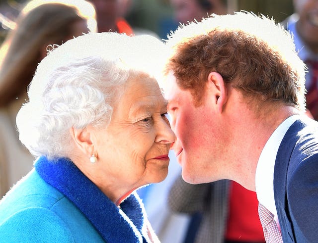 Queen Elizabeth II greets her grandson Prince Harry at the annual Chelsea Flower Show (Julian Simmonds/The Daily Telegraph/PA)