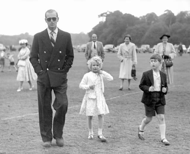 A young Anne with brother Charles and father Philip 