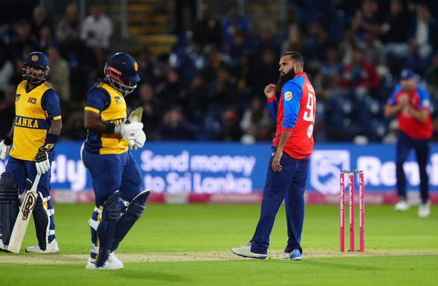 Adil Rashid celebrates taking the wicket of Sri Lanka’s Charith Asalanka