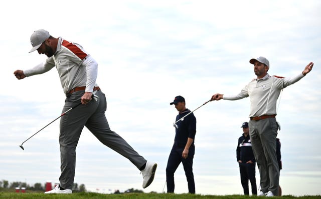 Jon Rahm and Sergio Garcia celebrate