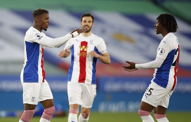 Crystal Palace’s Wilfried Zaha celebrates with Eberechi Eze after opening the scoring