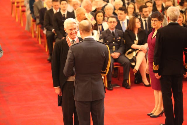 Brigadier Alastair Aitken is made a CBE by the Duke of Cambridge (Jonathan Brady/PA)