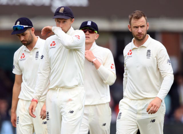 Joe Root, centre, and England leave the field after defeat to Pakistan