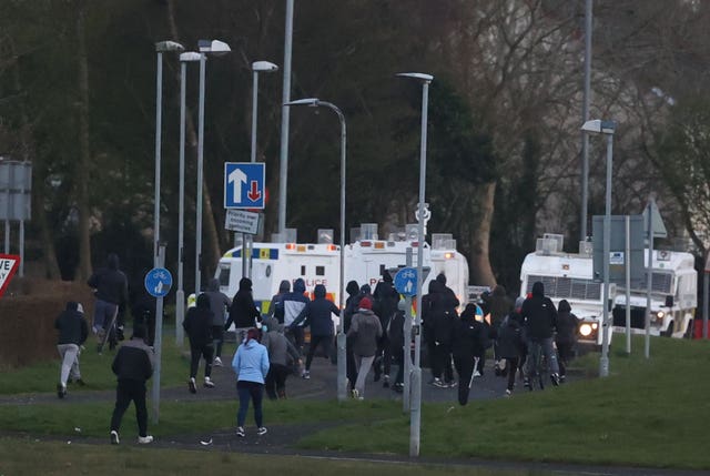 Youths gather near PSNI vehicles in Shantallow