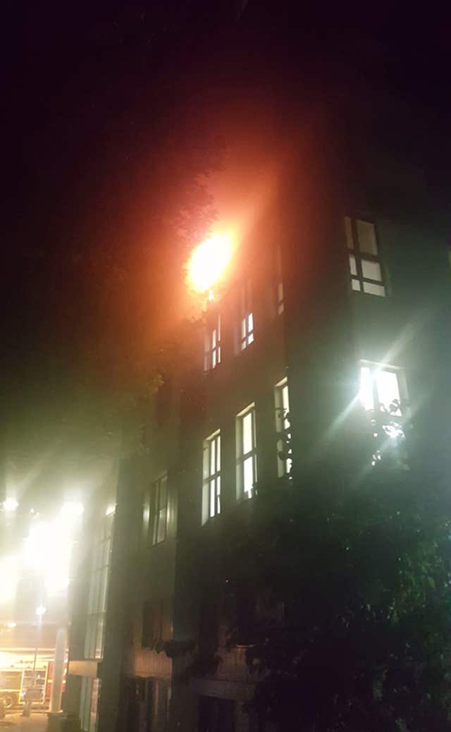 The fire spreading up the tower