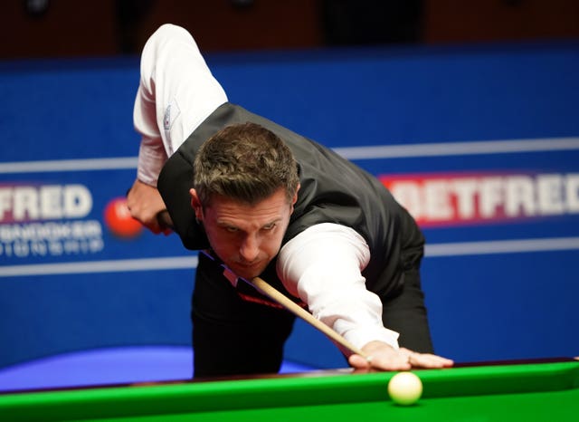 England's Mark Selby plays a shot during the semi-final