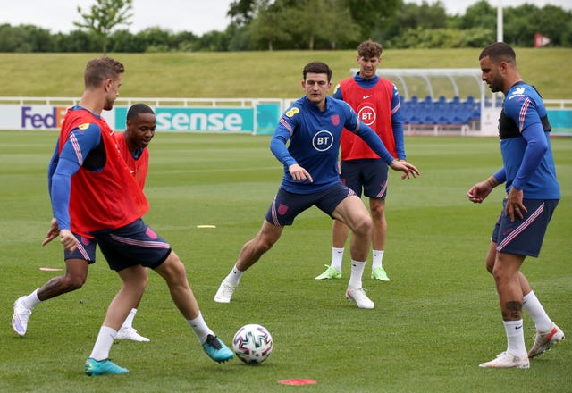 Harry Maguire (centre) joins in training with his England team-mates