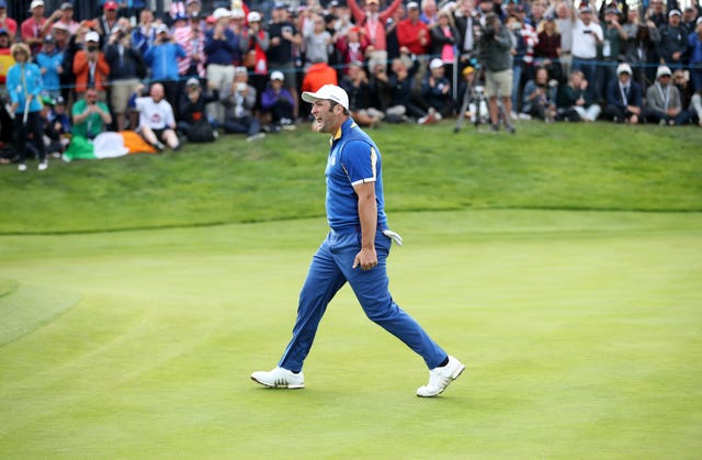 Rahm celebrates his victory against Woods