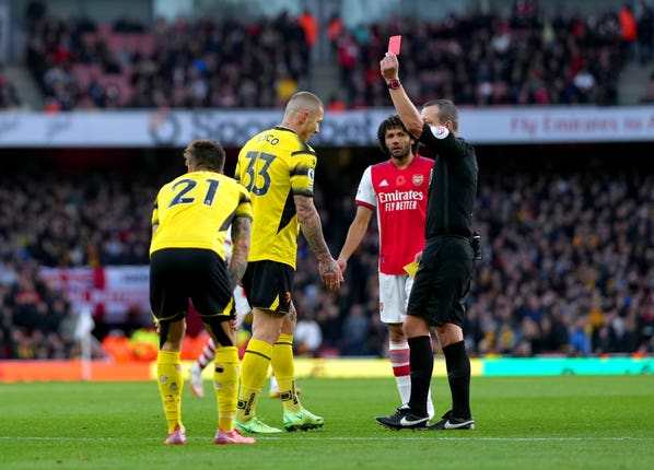 Juraj Kucka (centre) is shown the red card