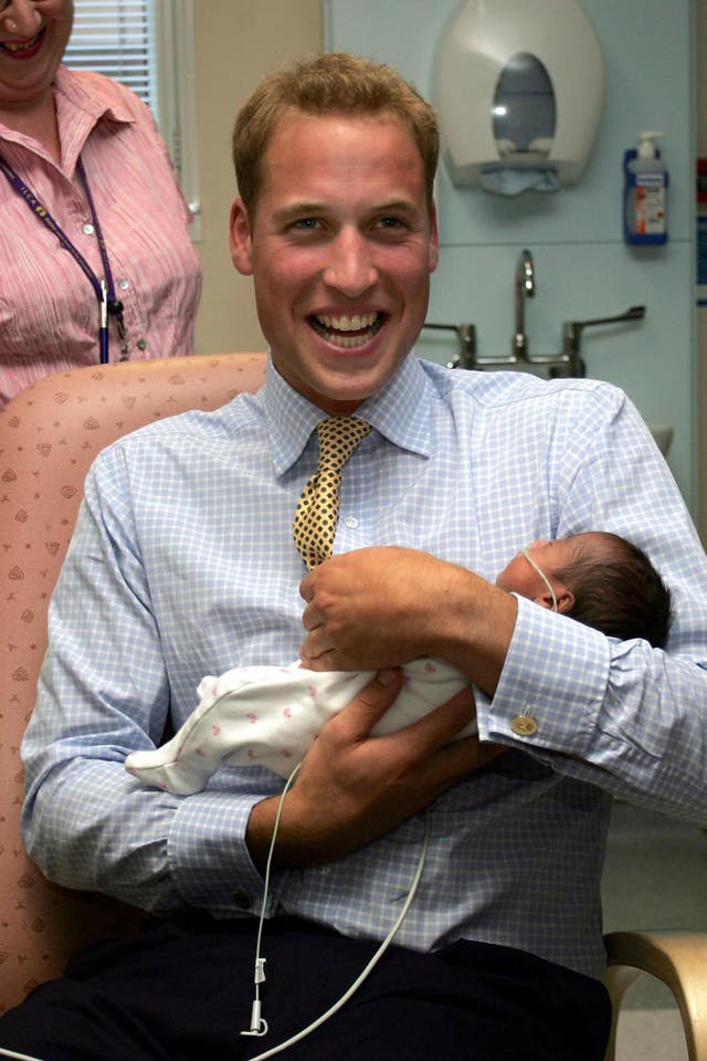 Prince William holds baby Sina Nuru in the Winnicott Baby Unit at St Mary’s Hospital, in London. (Tom Hevezi, PA Archive)