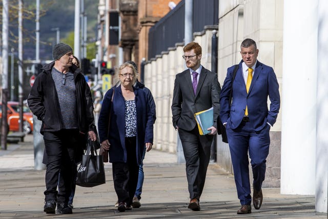 Joe McCann’s widow Anne, centre, and family with their solicitor Niall Murphy, right