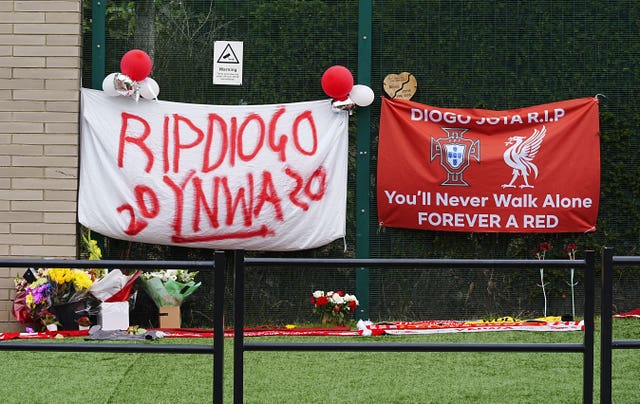Flowers and tributes to Diogo Jota outside the AXA Training Centre, Liverpool