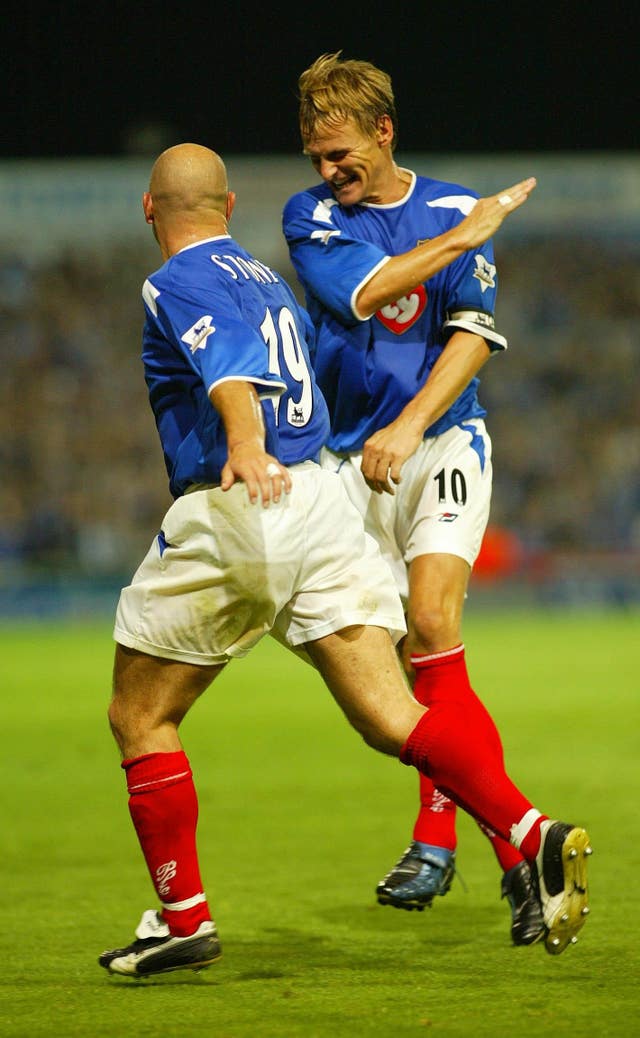 A 37-year-old Teddy Sheringham, right, celebrates a goal for Portsmouth