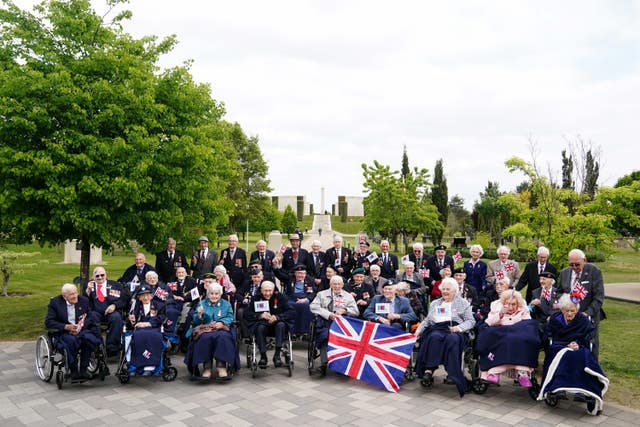 Second World War veterans have their photograph taken at the National Memorial Arboretum