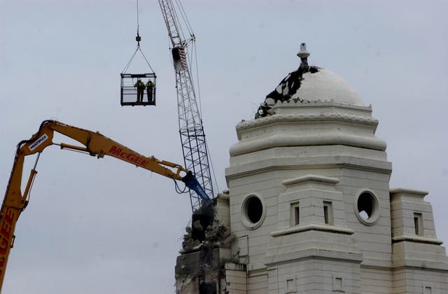 German excavator known as 'Goliath' begins the demolition on the Twin Towers 