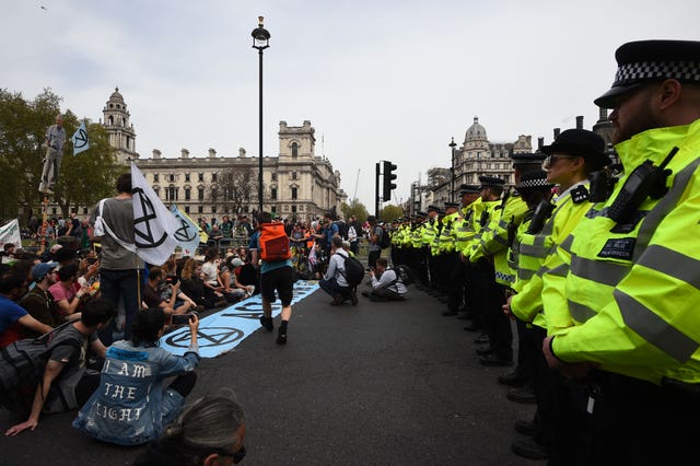 Police watch Extinction Rebellion protesters