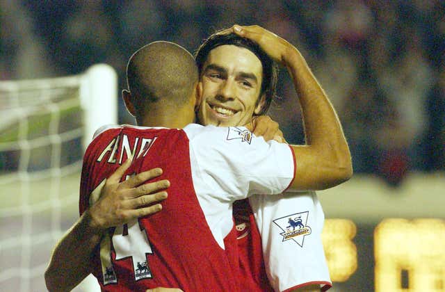 Thierry Henry, left, and Robert Pires embrace after Henry scored against Leeds