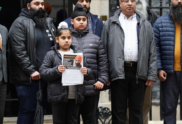 Members of the Free Jaggi Now Campaign hand in a petition to mark five years since the arrest of Jagtar Singh Johal 