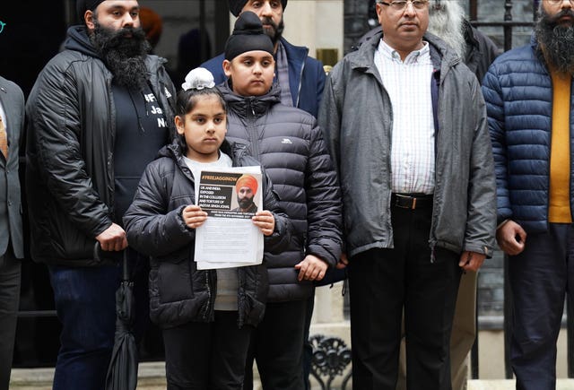 Members of the Free Jaggi Now Campaign hand in a petition to mark five years since the arrest of Jagtar Singh Johal