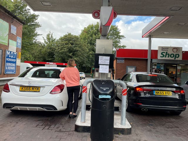 Handwritten signs on pumps at the at the Rainhill Petrol Station, Knowsley