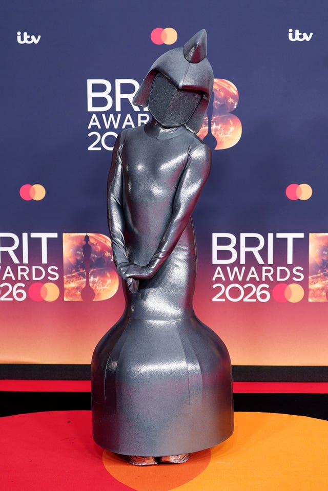 A performer dressed as a Brit Award attending the Brit Awards 2026 at Co-op Live in Manchester