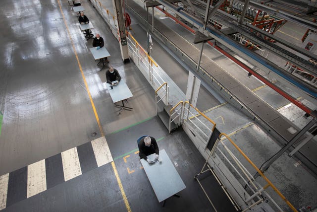 A photo issued by Historic England from its Picturing Lockdown Collection entitled Social distancing, Vauxhall car factory, Wirral by Colin McPherson