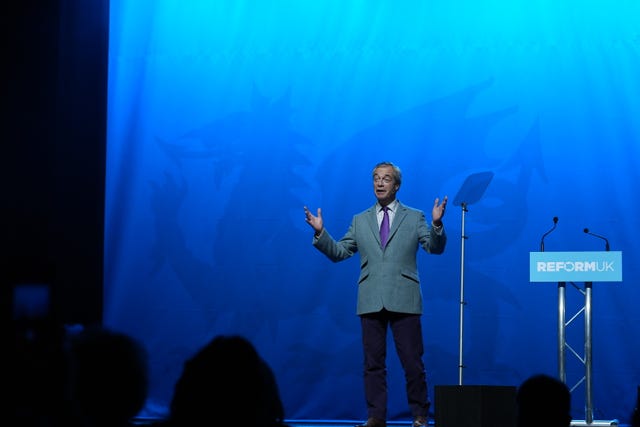 Reform Party leader Nigel Farage speaks during a Reform UK rally at Venue Cymru, Llandudno