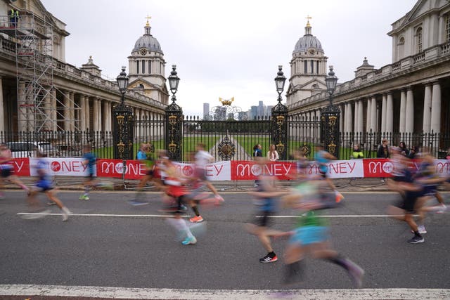 Runners pass the Old Naval College