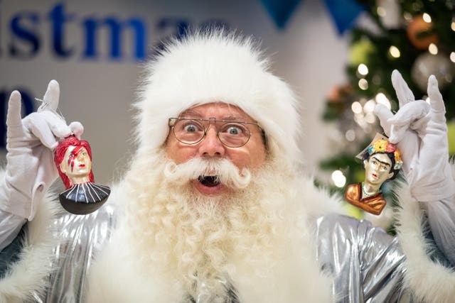 Santa shows off David Bowie and Frida Kahlo decorations