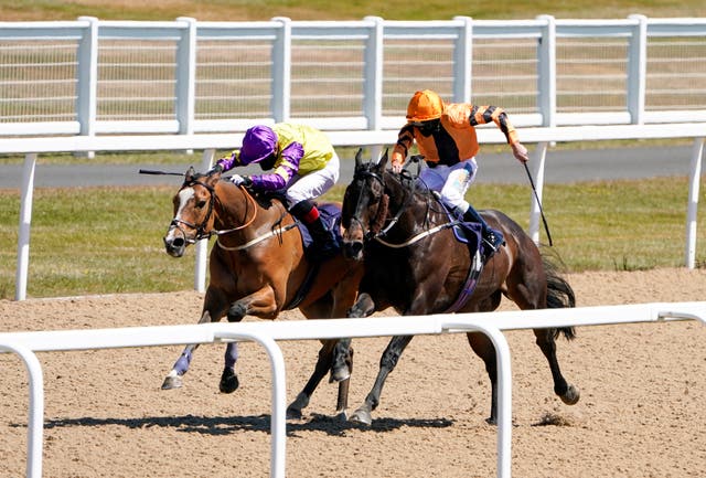 Zodiakos (orange) and jockey James Sullivan en route to a memorable victory in Newcastle.