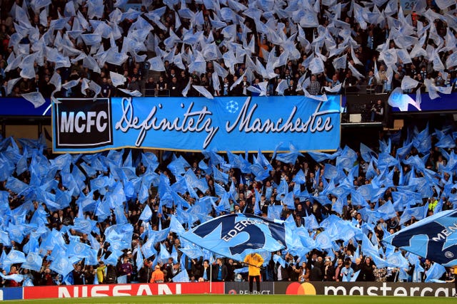 Manchester City supporters create a sea of blue before kick-off at the Etihad