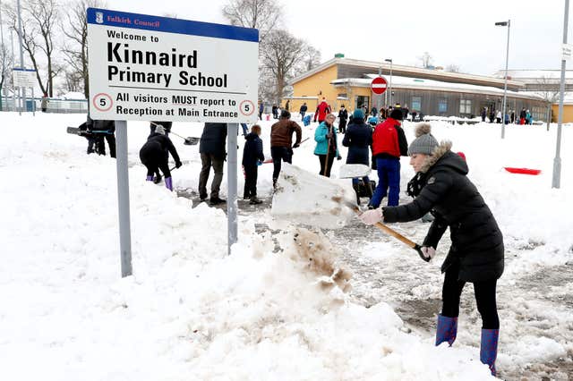 Larbert in Scotland begin clearing the grounds of Kinnaird Primary School (Andrew Milligan/PA)