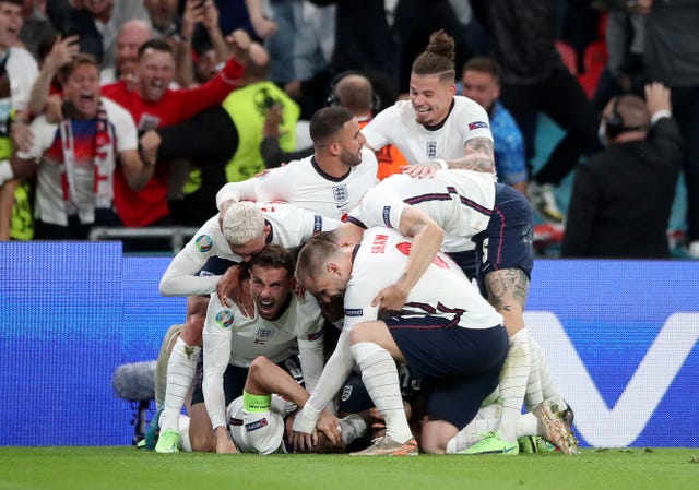 England’s Harry Kane is mobbed by team-mates after scoring the winner 