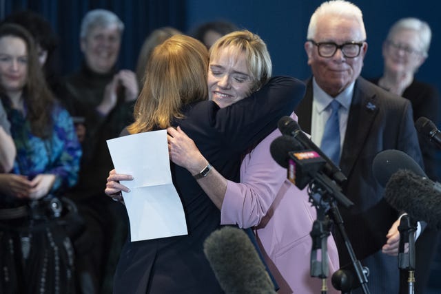 Sandie Peggie hugging her solicitor