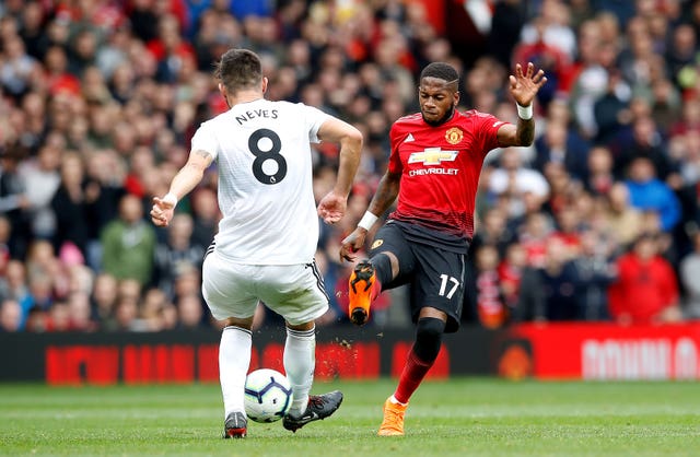 Ruben Neves, left, helped Wolves secure a point at Old Trafford