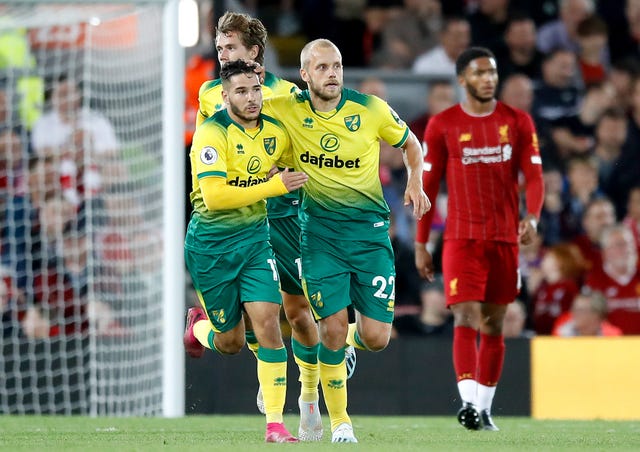 Teemu Pukki, right, celebrates his goal at Anfield 