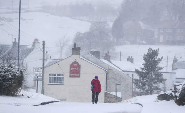 Five weather warnings are in place as heavy rain and snow blight swathes of the country (Owen Humphreys/PA)
