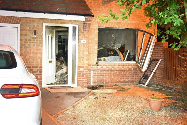 The scene in Rawcliffe, York, where James Andrew Sparham smashed his powerful car into a family’s front room (North Yorkshire Police/PA)