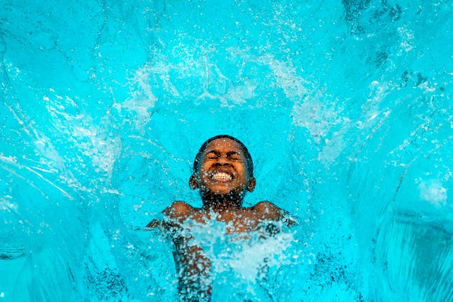 Reuben Hurst, 13, jumps into Charlton Lido in south London