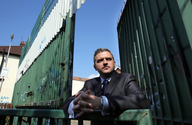Dr Adrian Johnston chairman of the International Fund for Ireland at a peace wall interface on Springfield Road, Belfast