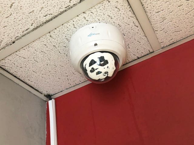 A CCTV camera painted white inside the William Hill next door to George Attenborough and Son Jewellers on Fleet Street
