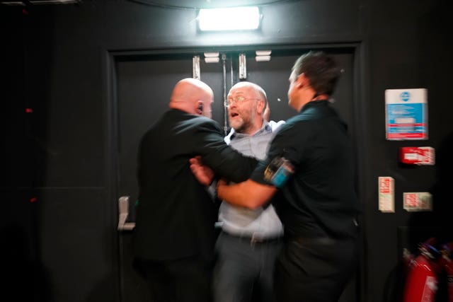 The heckler being ejected