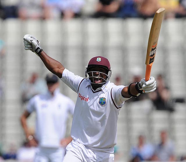 Tino Best celebrates after reaching his half-century against England (Nigel French/PA)