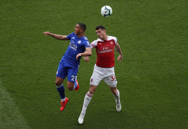 Youri Tielemans and Arsenal's Granit Xhaka challenge for the ball