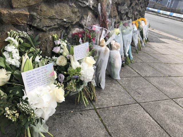 Tributes have been left near the scene (Rod Minchin/PA)