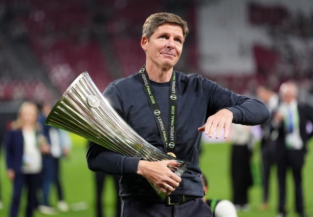Crystal Palace manager Oliver Glasner celebrates with the Conference League trophy