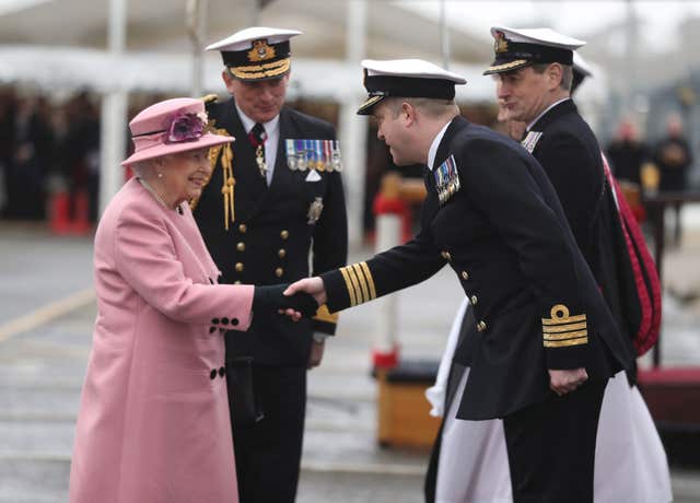 Queen Elizabeth II with First Sea Lord Admiral Sir Philip Jones (2nd left) meet Captain of HMS Ocean Captain Rob Pedre (2nd right) at the decommissioning ceremony for HMS Ocean (Andrew Matthews/PA)