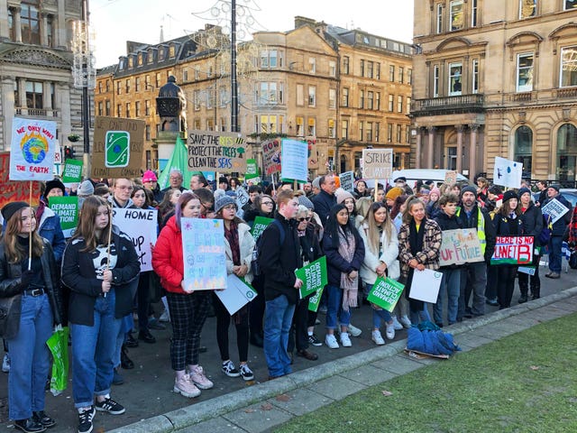 A crowd listens to Scottish Greens co-leader Patrick Harvie at a climate strike in Glasgow