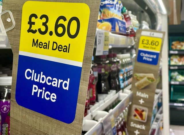 A Clubcard sign at a Tesco Express